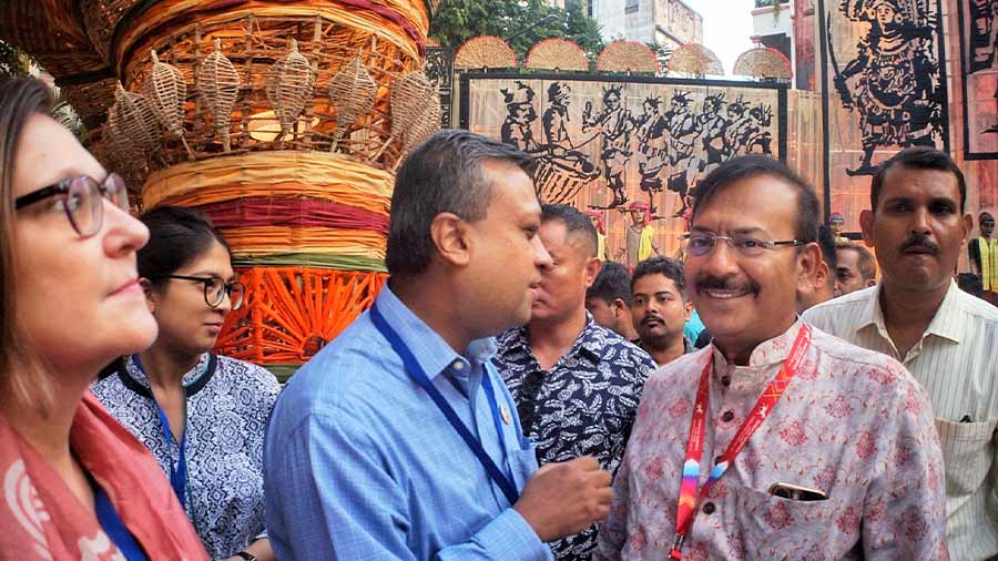 Minister Aroop Biswas greets the Green Puja judges at the Suruchi Sangha puja on Saptami