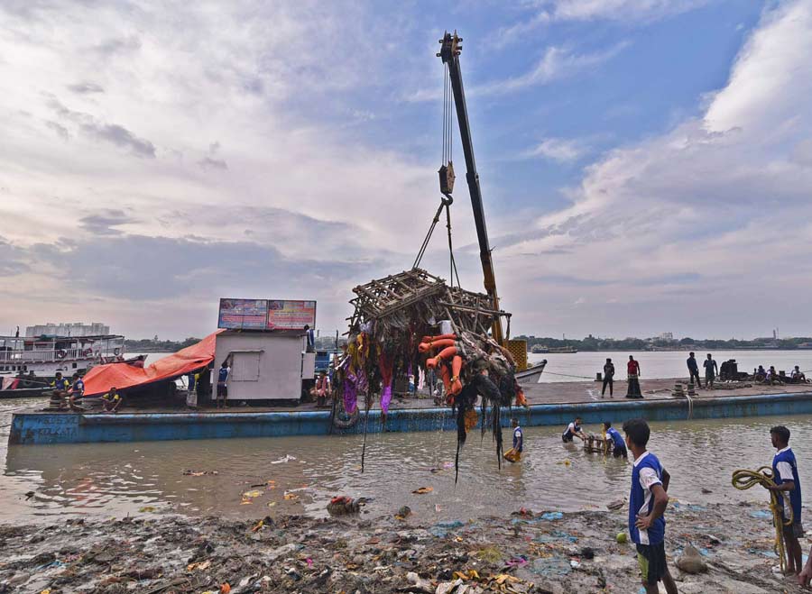 Huge cranes have been deployed to remove debris immediately post immersion from the river to curb water pollution  