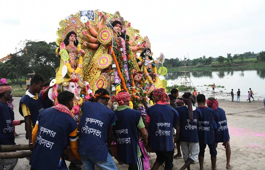 Immersion of Durga idol in Jalongi river on Tuesday. It is a tributary of the Hooghly river that flows through the districts of Murshidabad and Nadia 