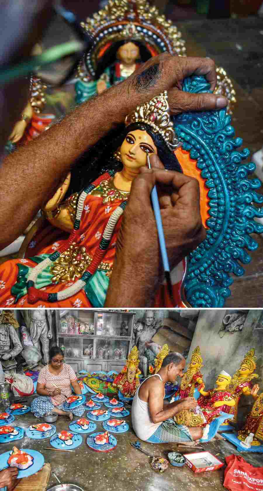Artisans give finishing touches to Laxmi idols and ‘shoras’ at Kumartuli on Wednesday  