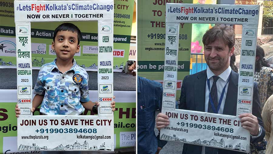 A child and (right) Nicolas Facino, director of Alliance française du Bengale in Kolkata, take turns to get clocked within the climate photo frame