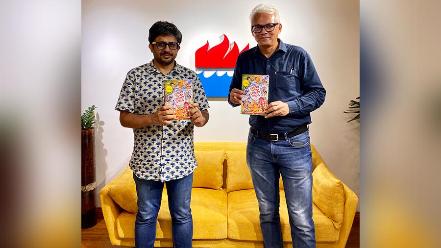 Abhishek Mukherjee (left) and Joy Bhattacharjya with their book at the HarperCollins India office