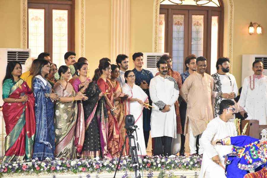 Mamata Banerjee, flanked by artistes from the Bengali film industry and other personalities, appreciate the performances from the Red Road main pavilion