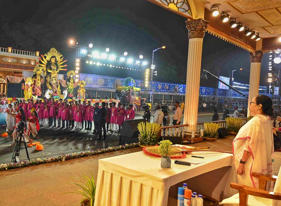 Chief minister Mamata Banerjee stood up and acknowledged almost every Durga Puja committee tableau passing by the main pavilion