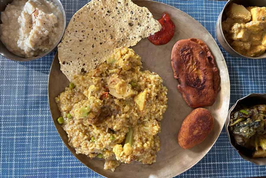 Lunch on Lakshmi Puja day at a Beleghata residence was replete with khichuri, subzi, fritters, chutney and payesh 