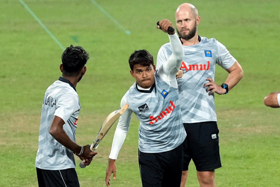 Sri Lanka’s Dunith Wellalage (centre) during training in Pune on Sunday.