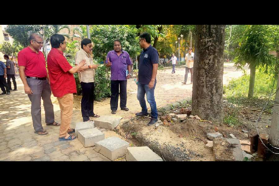 Civic chairman and councillor Sabyasachi Datta (centre) inspects renovation work at the Green Verge on Sunday.