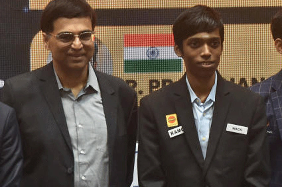 Rameshbabu Praggnanandhaa with Viswanathan Anand. Rameshbabu