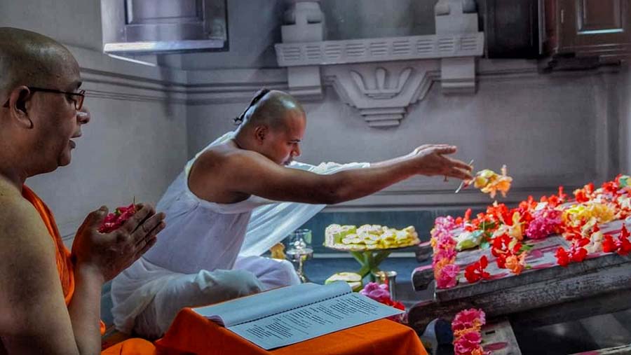 Monks worship the wooden pedestal for goddess Durga at Ramakrishna Math and Ramakrishna Mission, Belur Math, on Thursday