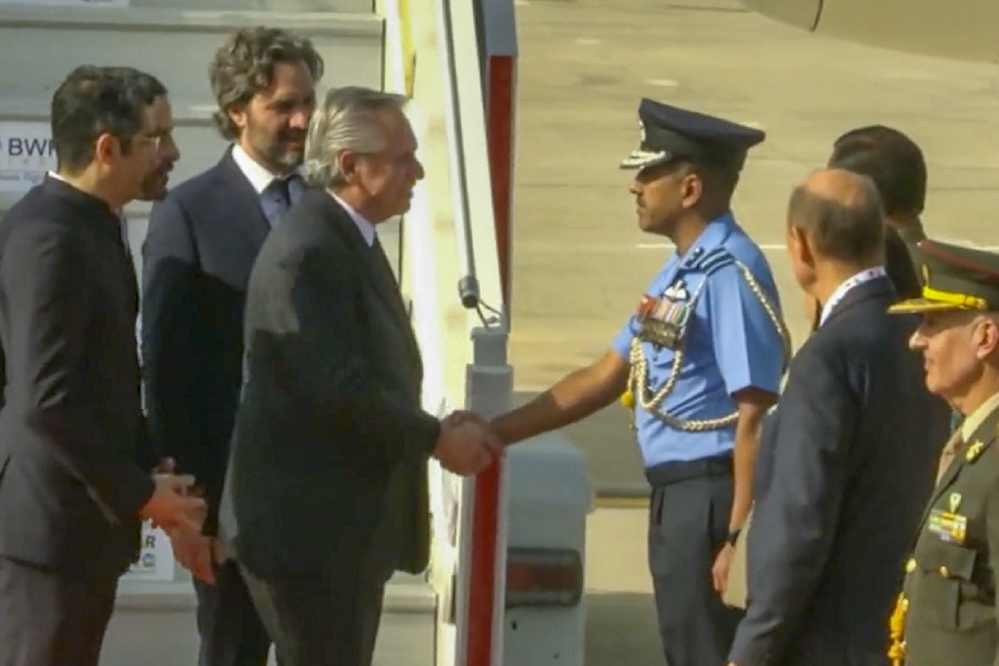 Argentina's President Alberto Fernandez being received upon his arrival at the airport