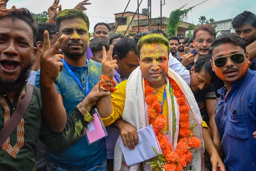 BJP candidate Bindu Debnath shows victory sign after his win in the Dhanpur assembly bypoll
