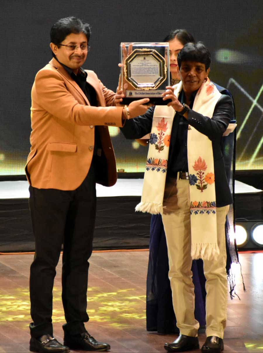 Cricket Association of Bengal president Snehasish Ganguly hands over the Kartick Bose Lifetime Achievment Award 2022-2023 to Raju Mukherjee at Dhano Dhannyo auditorium on Saturday. Sharmila Chakraborty was the other recipient of the award. Kalighat Club was feted for winning the First Division League   
