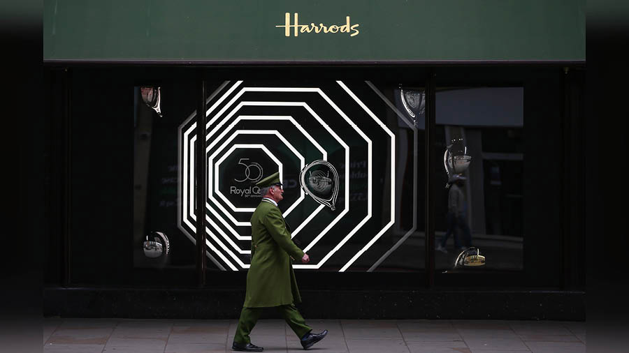 A doorman at Harrods luxury department store in London 