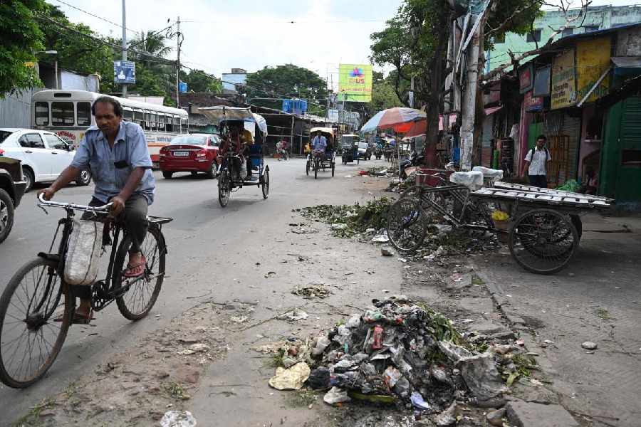 Mounds of garbage on Dum Dum Road, near Dum Dum Metro station on Monday