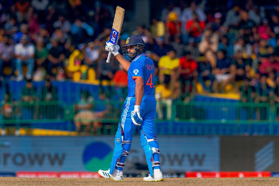 Indian captain Rohit Sharma celebrates after reaching his half century in Colombo.