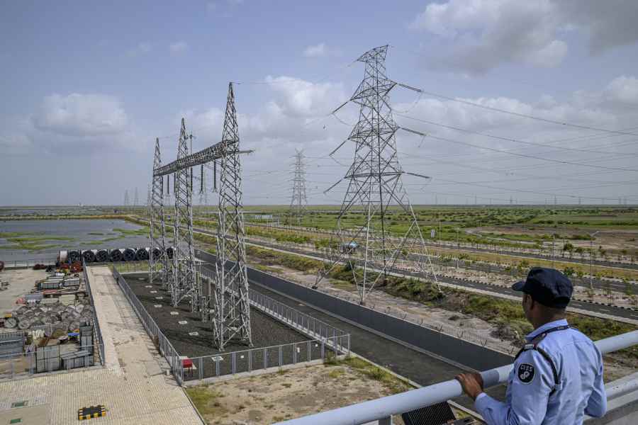 A security guard at Dholera Smart City, which is in the early stages of development, in Dholera, India, on Aug. 25, 2023. Investment in infrastructure like a robust power grid is one feature meant to lure businesses.