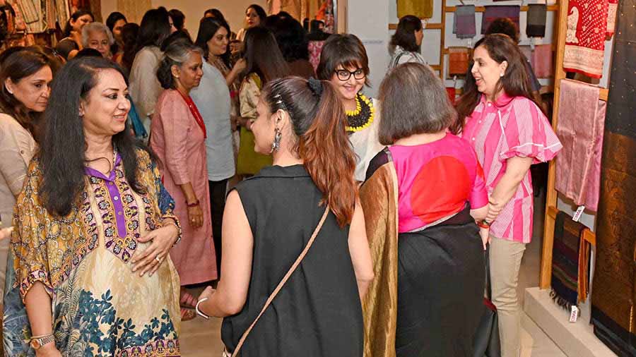 Actor Swastika Mukherjee talks to Rakhi Sarkar as viewers mill around CIMA, looking at the crafts on display
