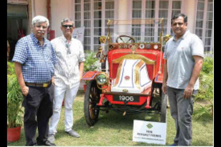 The organisers of the Historic Vehicle Display in association with Classic Drivers Club and t2 (l-r) Saturday Club president Rahul Johri, secretary Lt Col Gautam Nandy, and vice-president Shayak Gupta pose with the oldest car on show, the 1906 Renault Freres