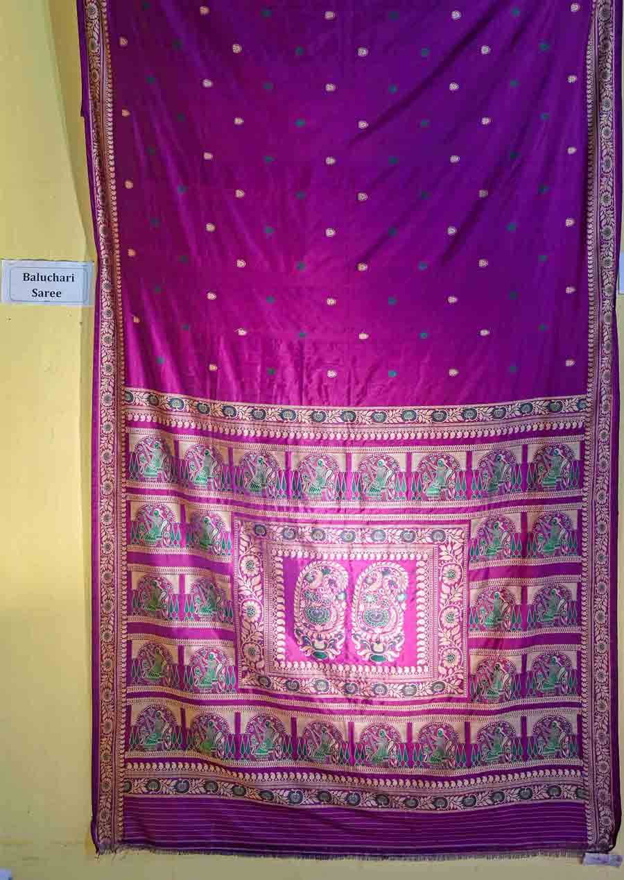 Baluchari and Swarnachari saris from Bishnupur are available at Rs 8,000 and upwards. This gorgeous purple sari can make you stand out at a wedding or on Nabami evening