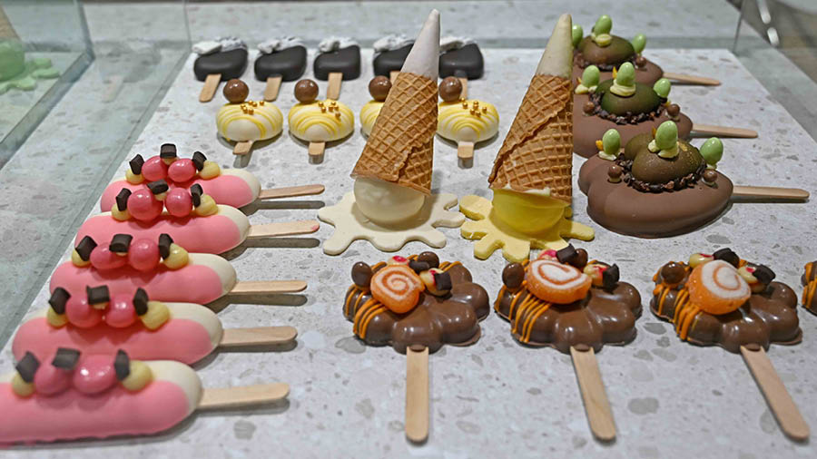 Chocolate coated popsicles on display