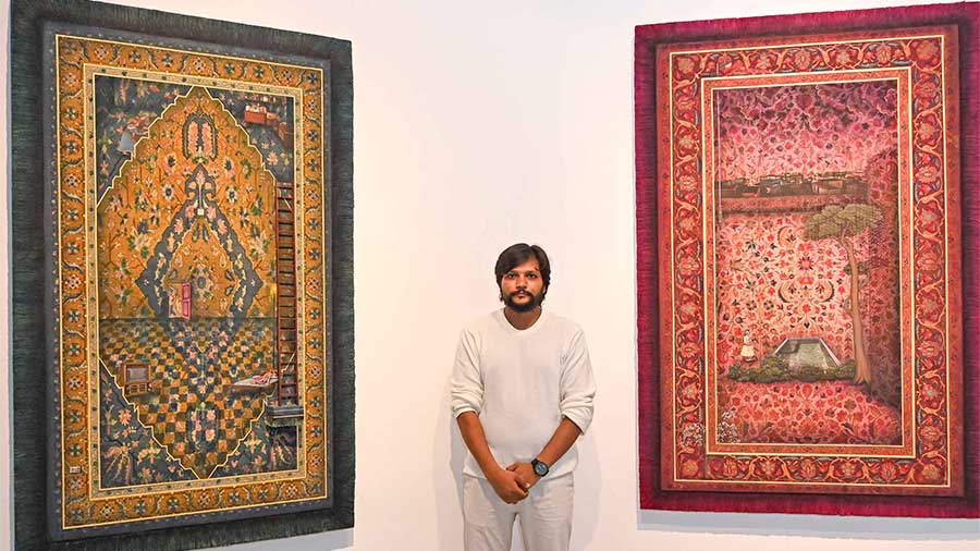 Ajay Dhapa poses before his exquisite artworks