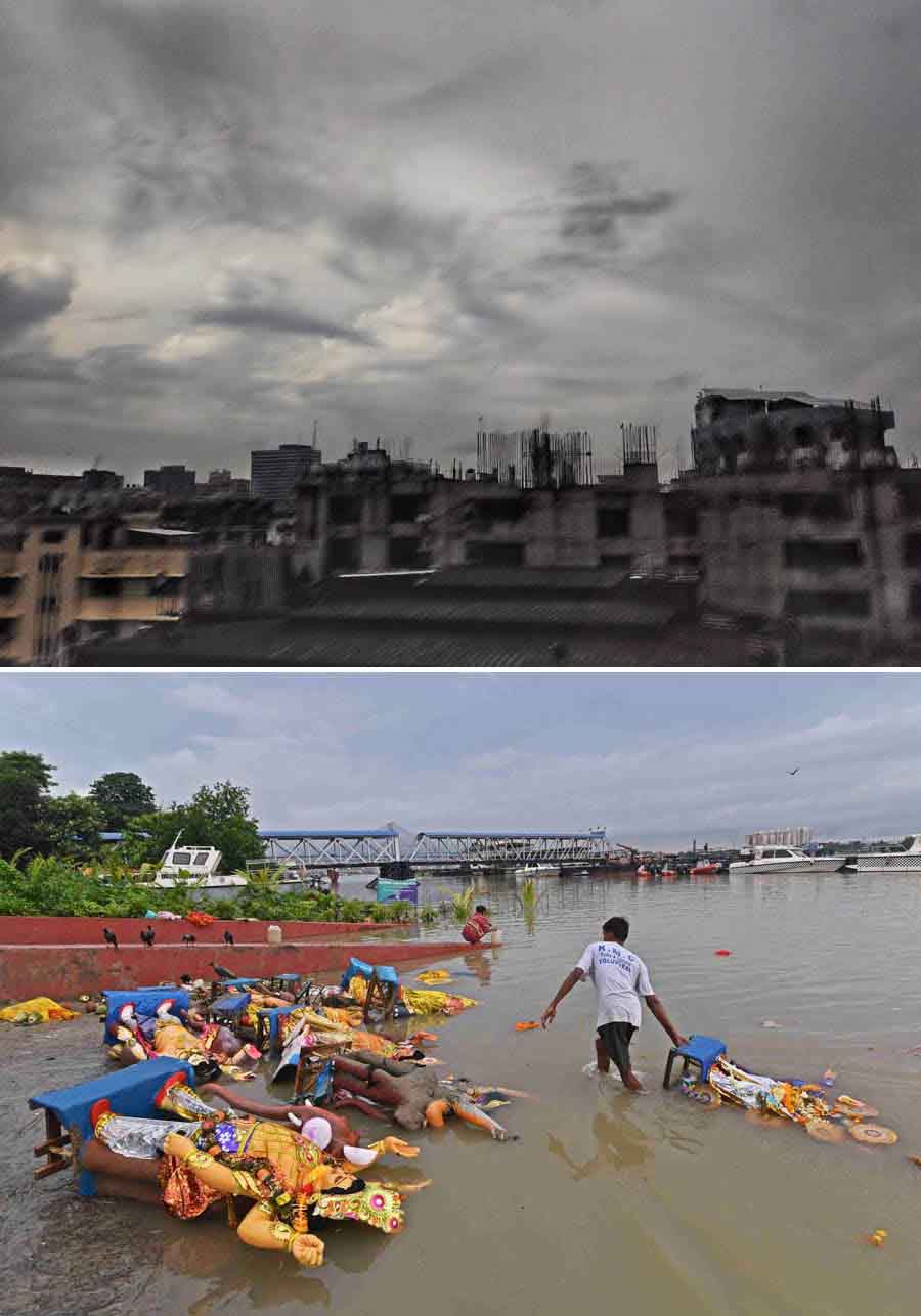 (Top) The cloudy sky over Kolkata and frequent drizzles on Wednesday seemed to capture the sombre mood following the (above) immersion of Vishwakarma idols. A volunteer of the Kolkata Municipal Corporation’s parks and squares department is seen collecting idol debris in the Hooghly on Wednesday to curb river pollution