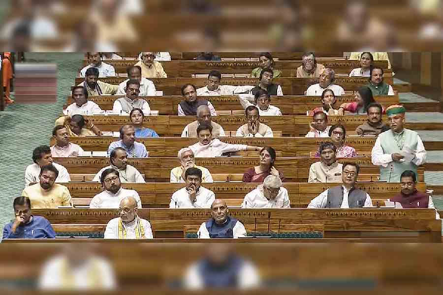 Union Home Minister Amit Shah, Defence Minister Rajnath Singh and other parliamentarins in the Lok Sabha during the special session of the Parliament