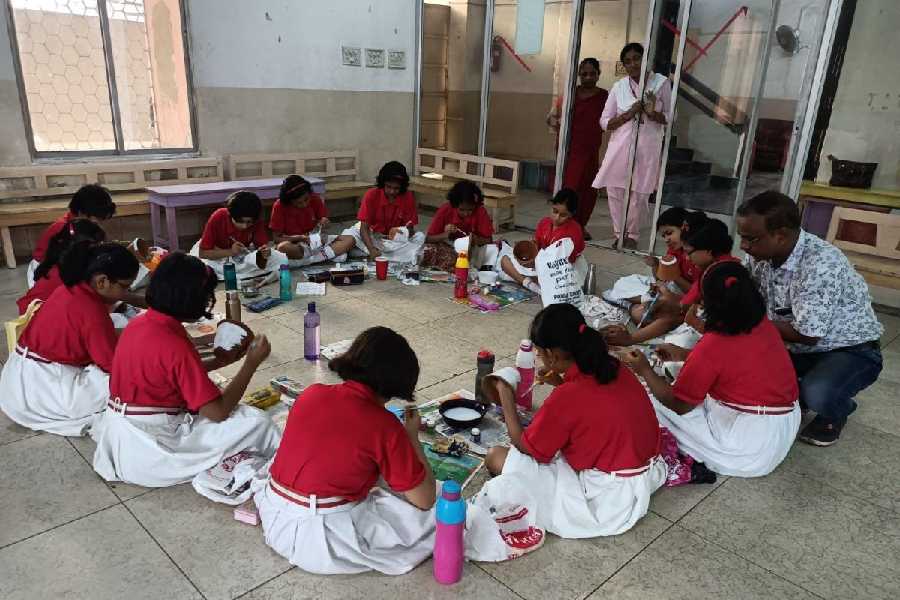 Students of Bidya Bharati, Behala, take part in pot painting
