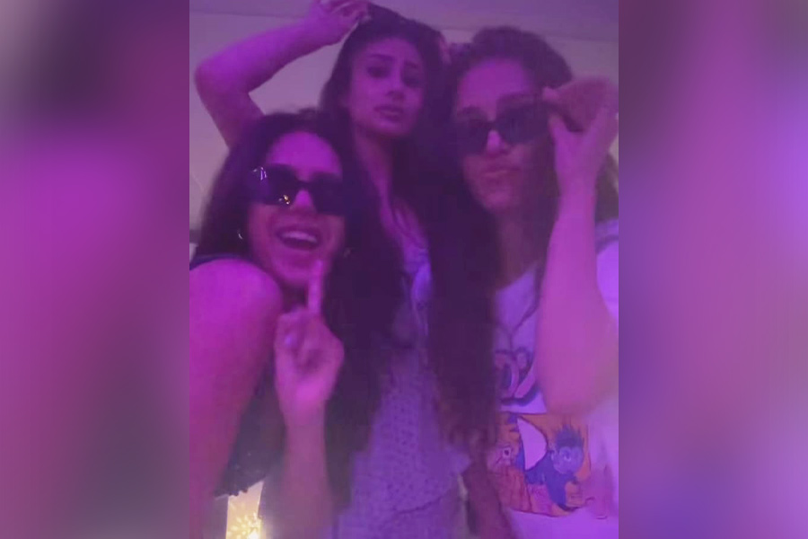 The trio wore sunglasses and danced to a Punjabi track in a neon-lit room. 