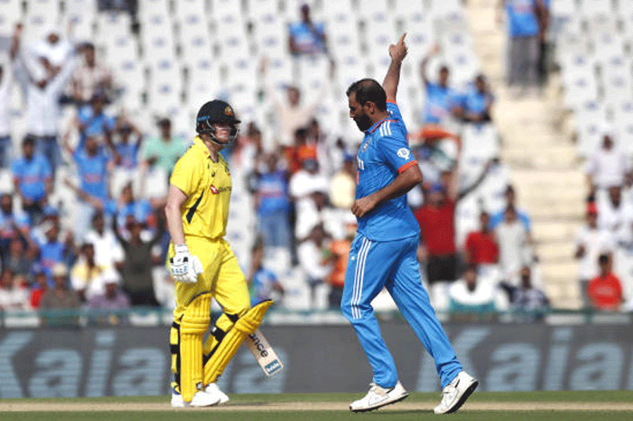 Mohammed Shami after getting Steve Smith (left) out for 41 on Friday.