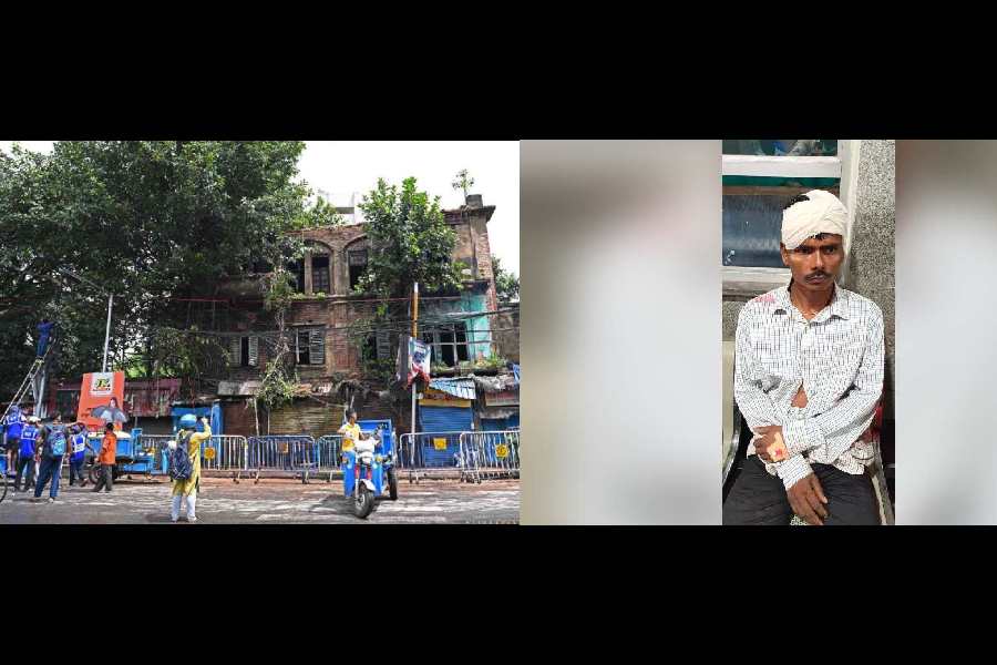 Police guardrails cordon off the house on 45 Deshpran Sasmal Road in Tollygunge whose portion of a balcony collapsed on Saturday; (right) pedestrian Chandan Barman who was injured in the incident.