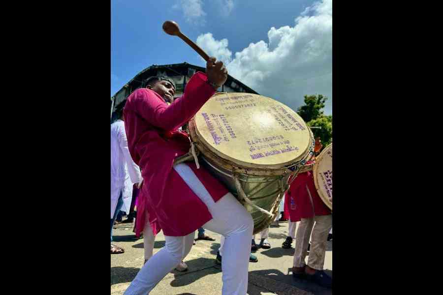 Musicians playing dhol captured through the main camera