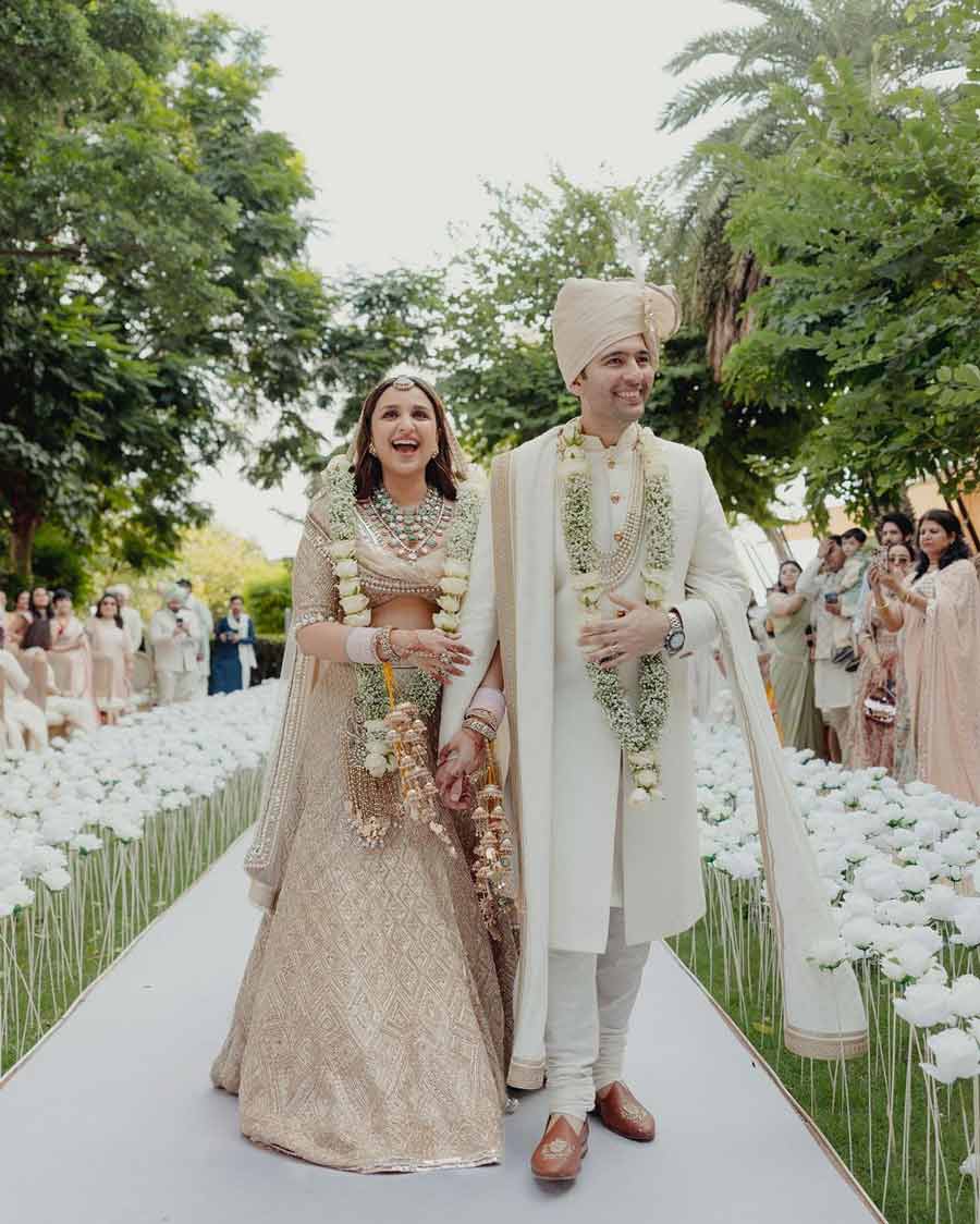 Parineeti Chopra looked radiant in a blush pink lehenga, while Raghav Chadha exuded elegance in an off-white sherwani. 