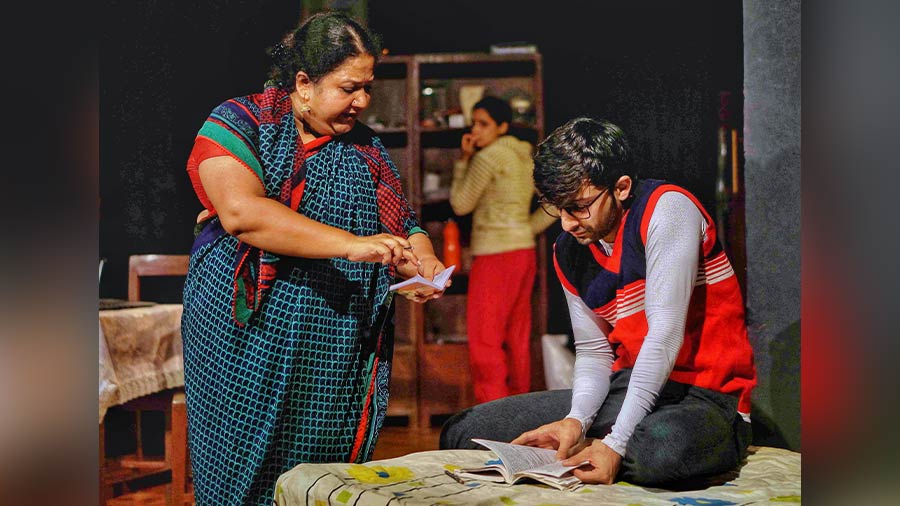 Actors Rasika Agashe as the mother and Abhishek Chauhan as the brother in a scene from the play