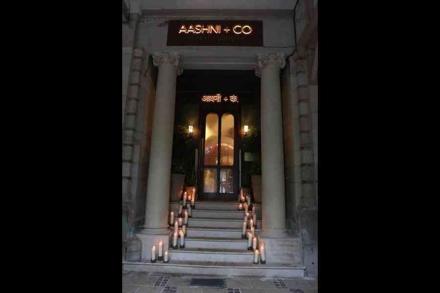 The staircase leading up to the entrance of Aashni + Co was lit up with candles on launch day