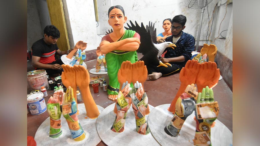 Artists at work at the Shyambazar Palli Sangha Durga Puja pandal