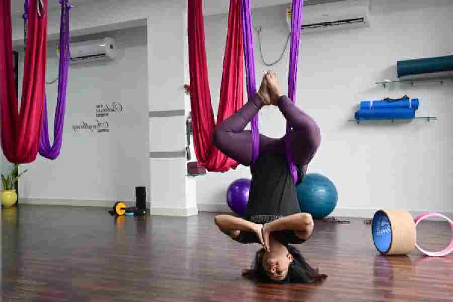 Anti-gravity yoga inversions help release tension, and increase blood circulation and energy levels