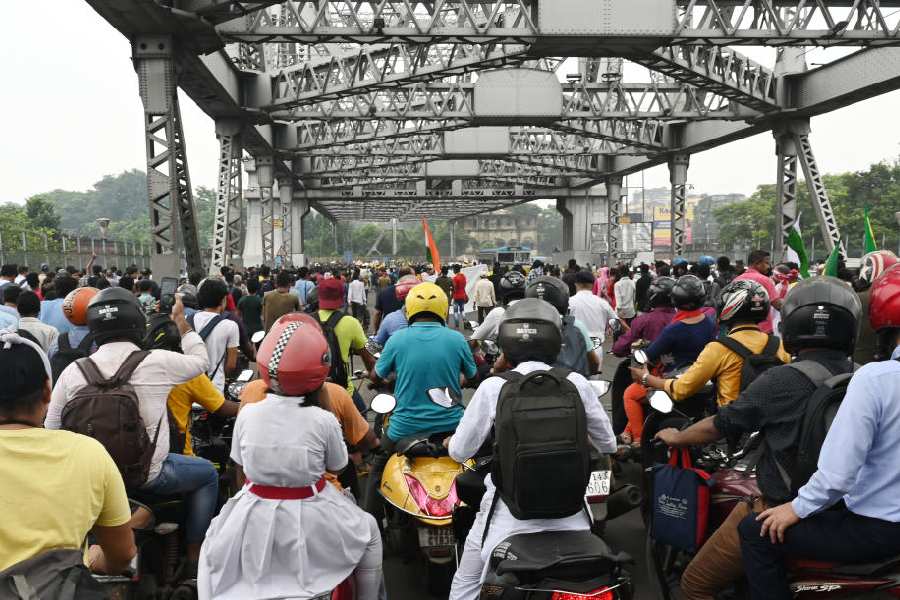 Commuters stuck in a traffic jam on Howrah bridge for the rally