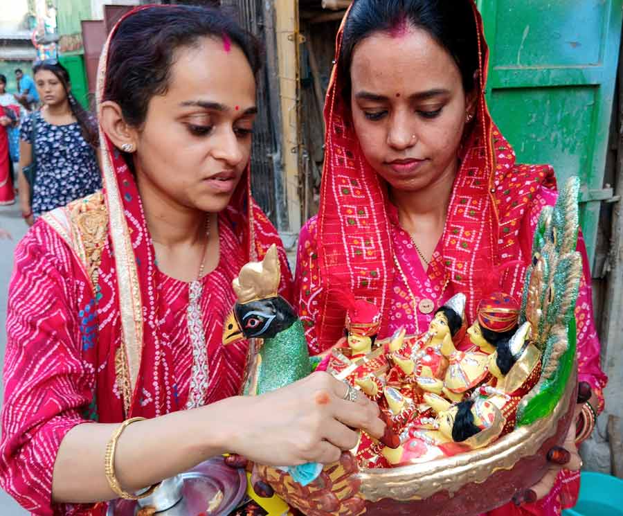 Women devotees celebrate Gangaur Puja which is one of the most important festivals of Rajasthan. Women were seen taking home idols from Kumartuli for the puja  