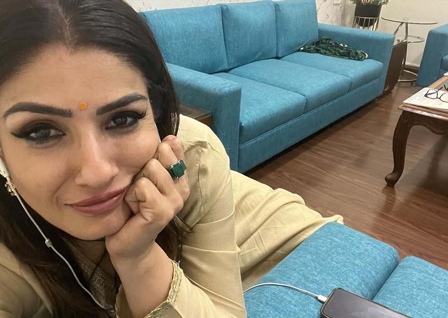 After a tiring yet memorable day, Raveena unwound on a couch, clicking a selfie in a beige kurta.  