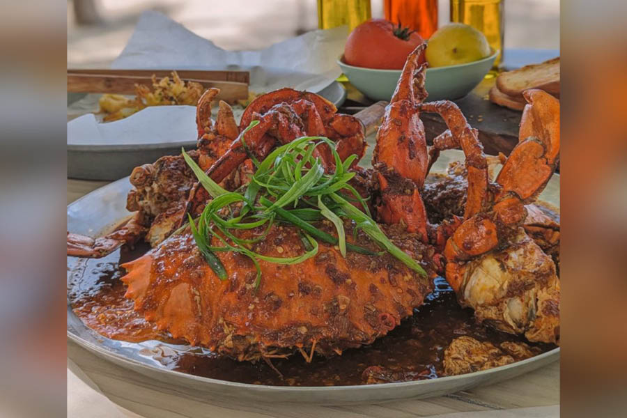 Dig into a whole chilli crab like no one is watching