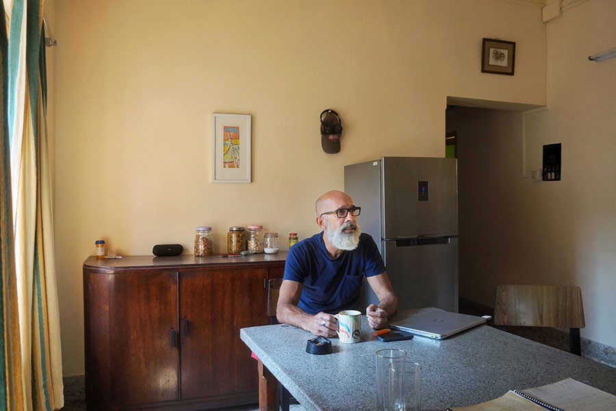 Janam Mukherjee, author of ‘Hungry Bengal’, at his house in Tollygunge, where he spends two months every year