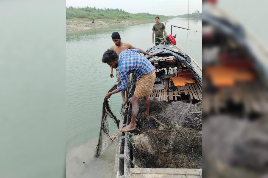‘Ghost nets’ being pulled out of a tributary of the Padma in Murshidabad