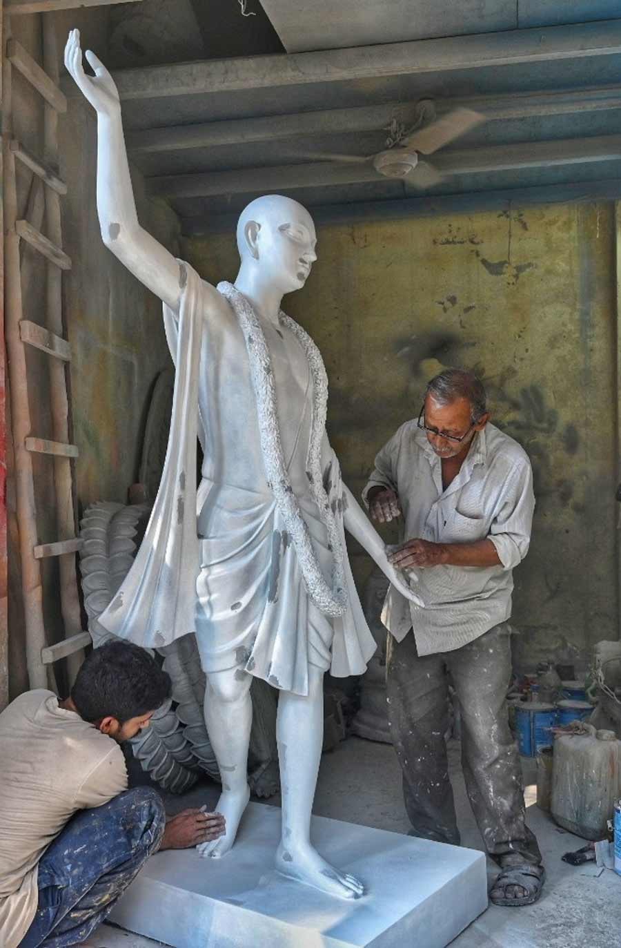 During off seasons, the Kumartuli artisans work on making various statues. In picture, an artist gives finishing touches to a statue of Chaitanya  