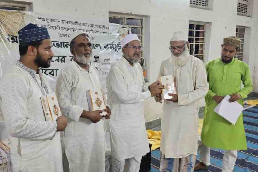 Bengali translations of The Quran being distributed at the iftaar gathering in New Town