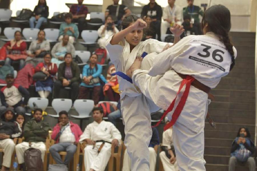 Girls fight it out in the karate tournament at the business club
