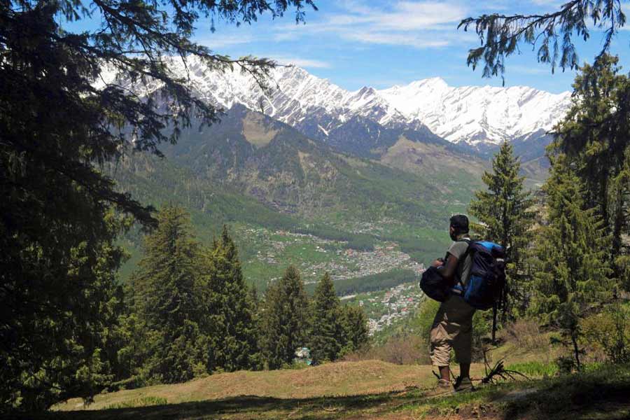 Bird’s-eye view of Manali from a viewpoint near Tilgan meadows with Dhauladhar and Pir Panjal ranges in the backdrop
