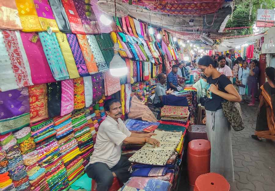 Before Poila Baisakh, markets witnessed brisk Chaitra Sale. Women were seen shopping for garments and accessories at Gariahat on Monday  