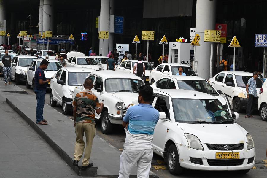 Cars (marked) parked illegally in a lane that is supposed to be free for the movement of vehicles at the Calcutta airport on Monday.