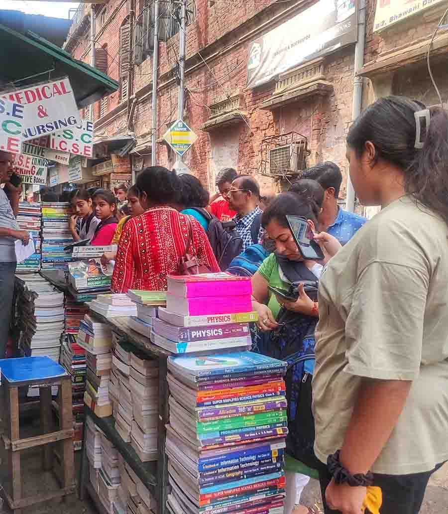 Students and guardians scout College Street for books as the new academic year begins in city schools  